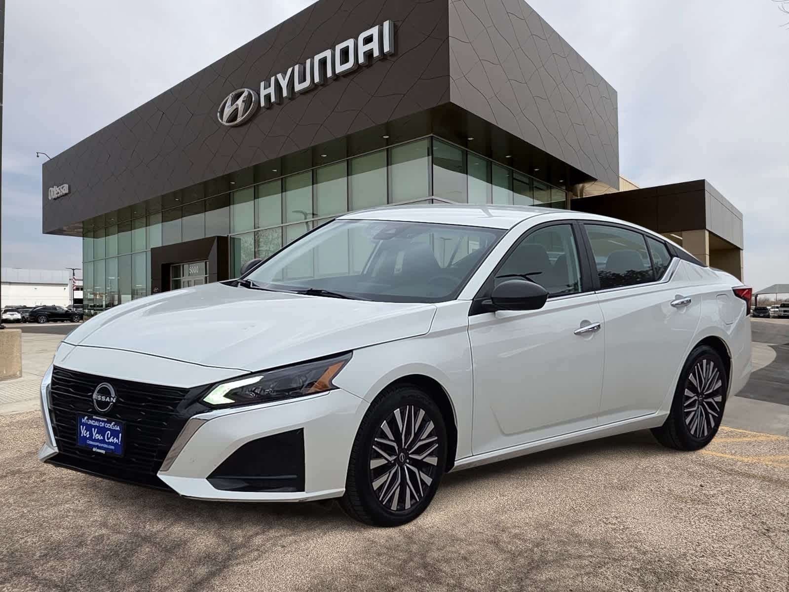 2024 Nissan Altima 2.5 SV in Pearl White Tricoat — front three-quarter view