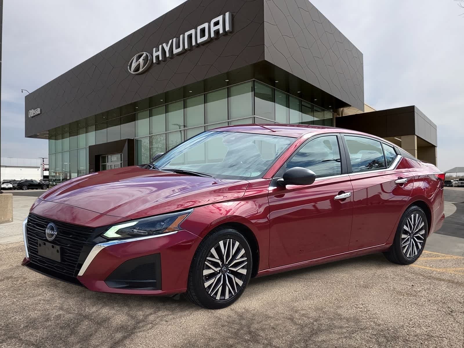 2024 Nissan Altima 2.5 SV in Scarlet Ember — front three-quarter view