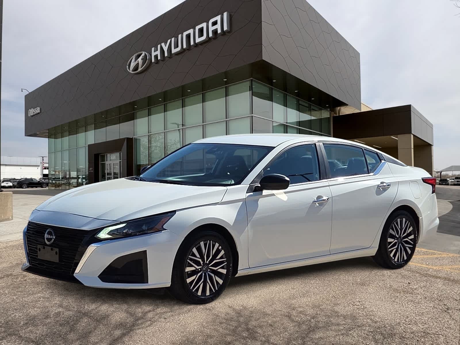 2025 Nissan Altima SV in Glacier White — front three-quarter view