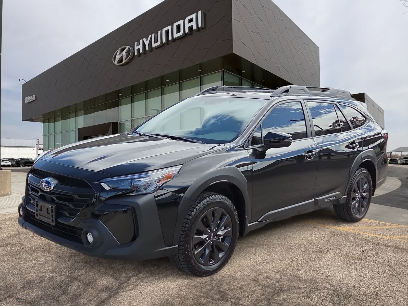 2025 Subaru Outback Onyx Edition in Crystal Black Silica — front three-quarter view