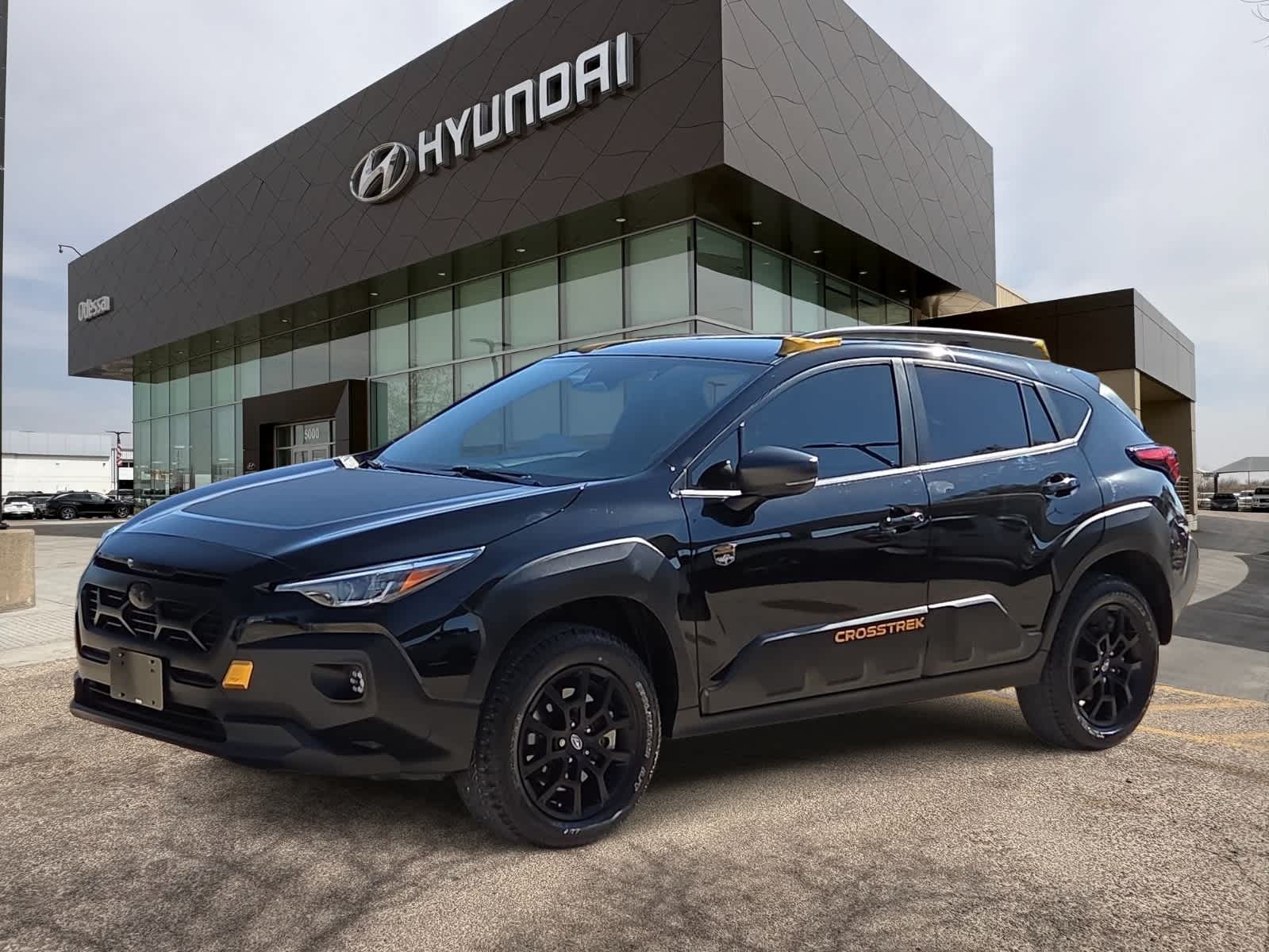 2024 Subaru Crosstrek Wilderness in Crystal Black Silica — front three-quarter view