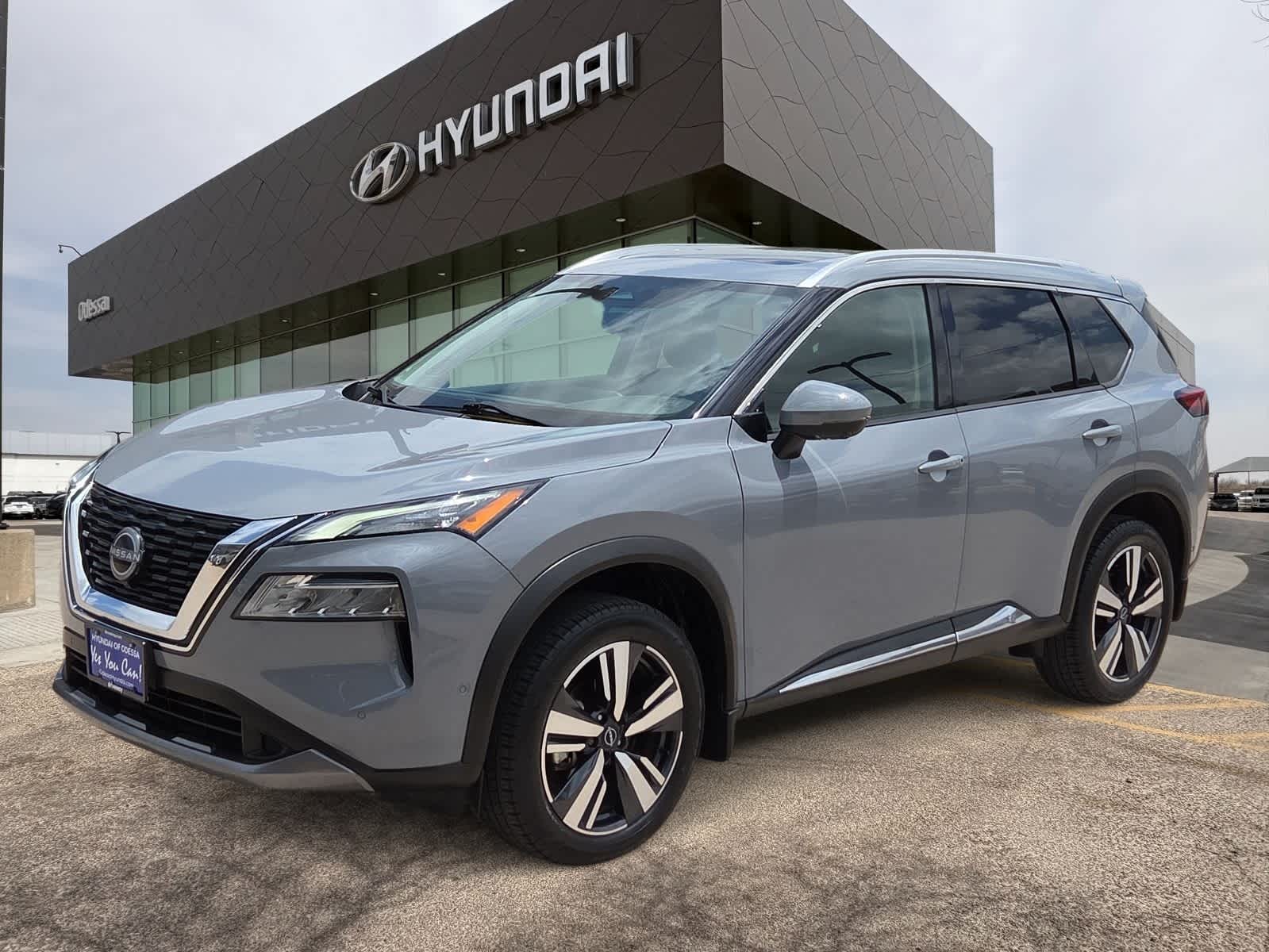 2023 Nissan Rogue SL in Boulder Gray Pearl — front three-quarter view