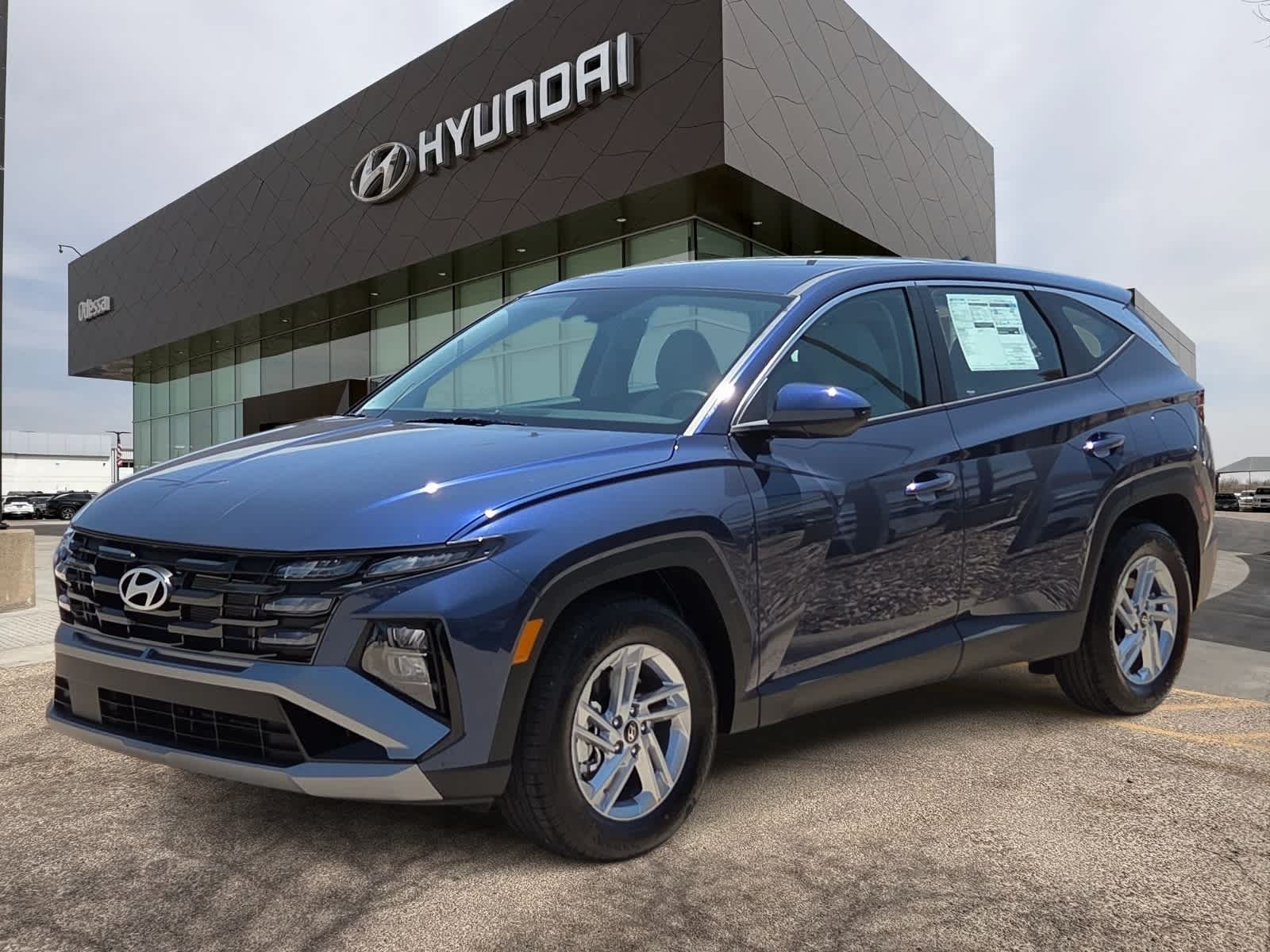 2026 Hyundai TUCSON SE in Atlantis Blue — front three-quarter view